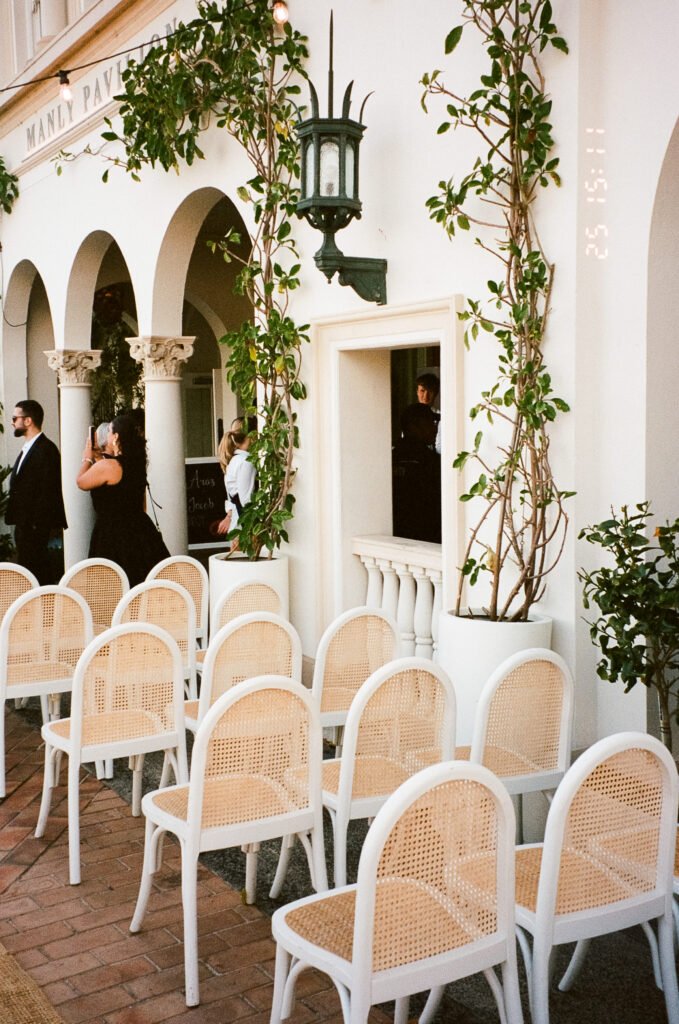 35mm film photo of wedding ceremony chairs arranged in the outdoor courtyard at Manly Pavilion