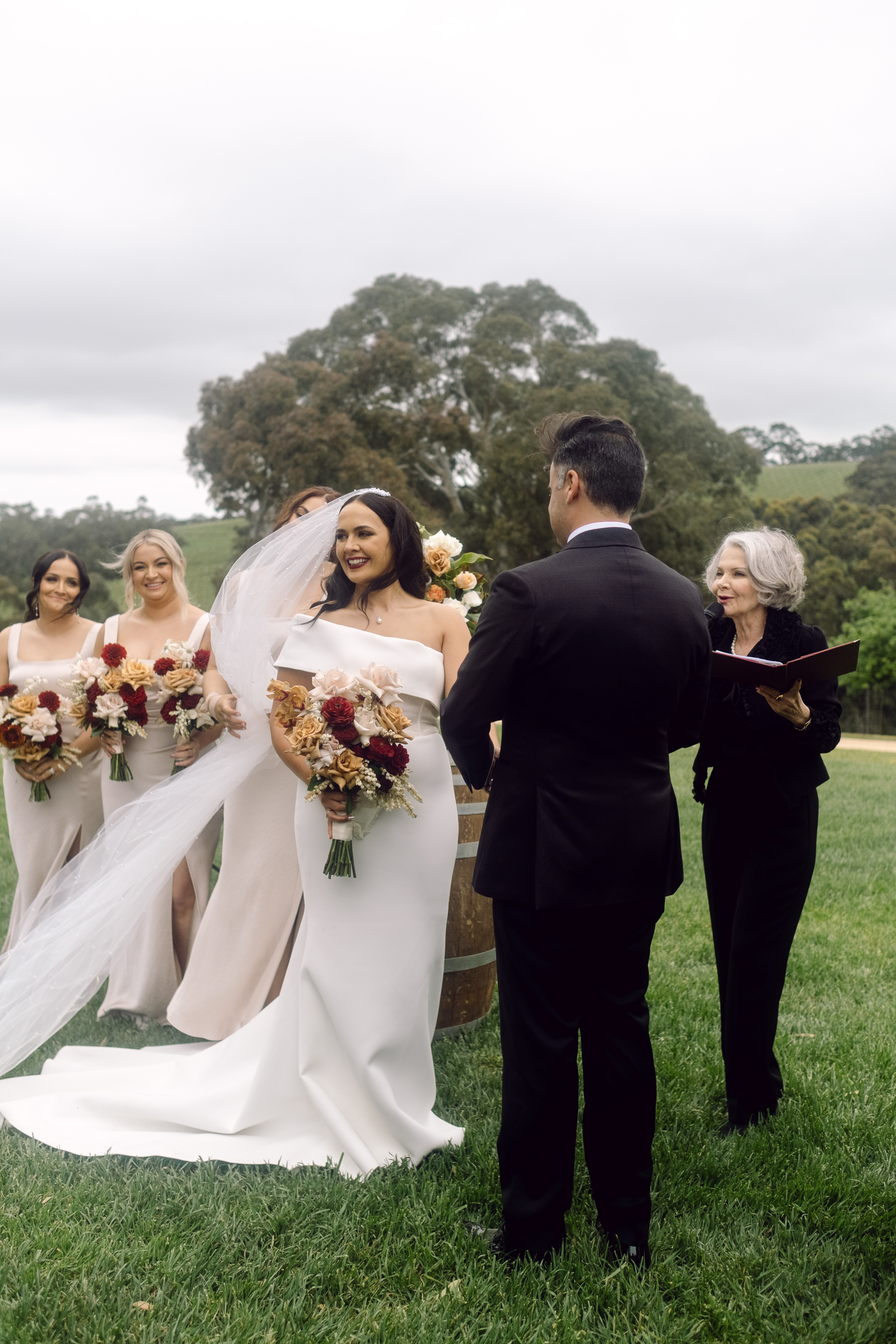 a bride and groom during their wedding ceremony at Longview Vineyard in the Adelaide Hills