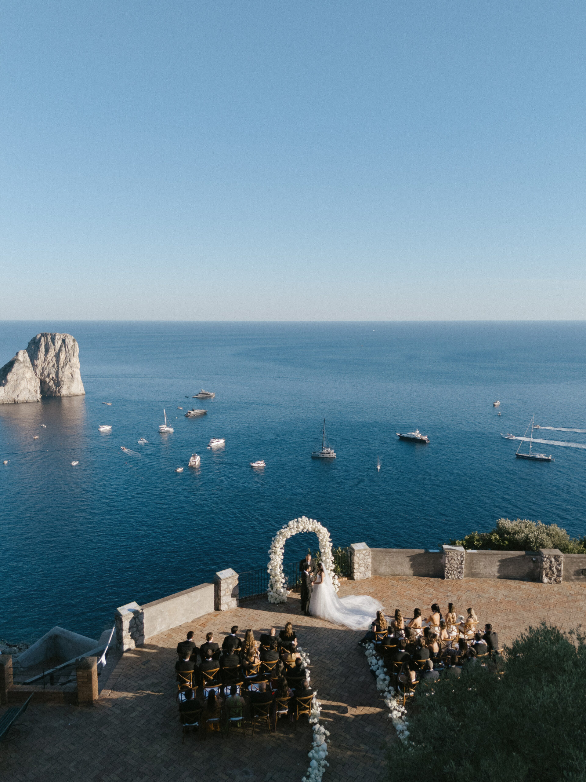 Destination wedding ceremony in Capri Italy overlooking the Mediterranean, photographed by Evelina Katarzynski