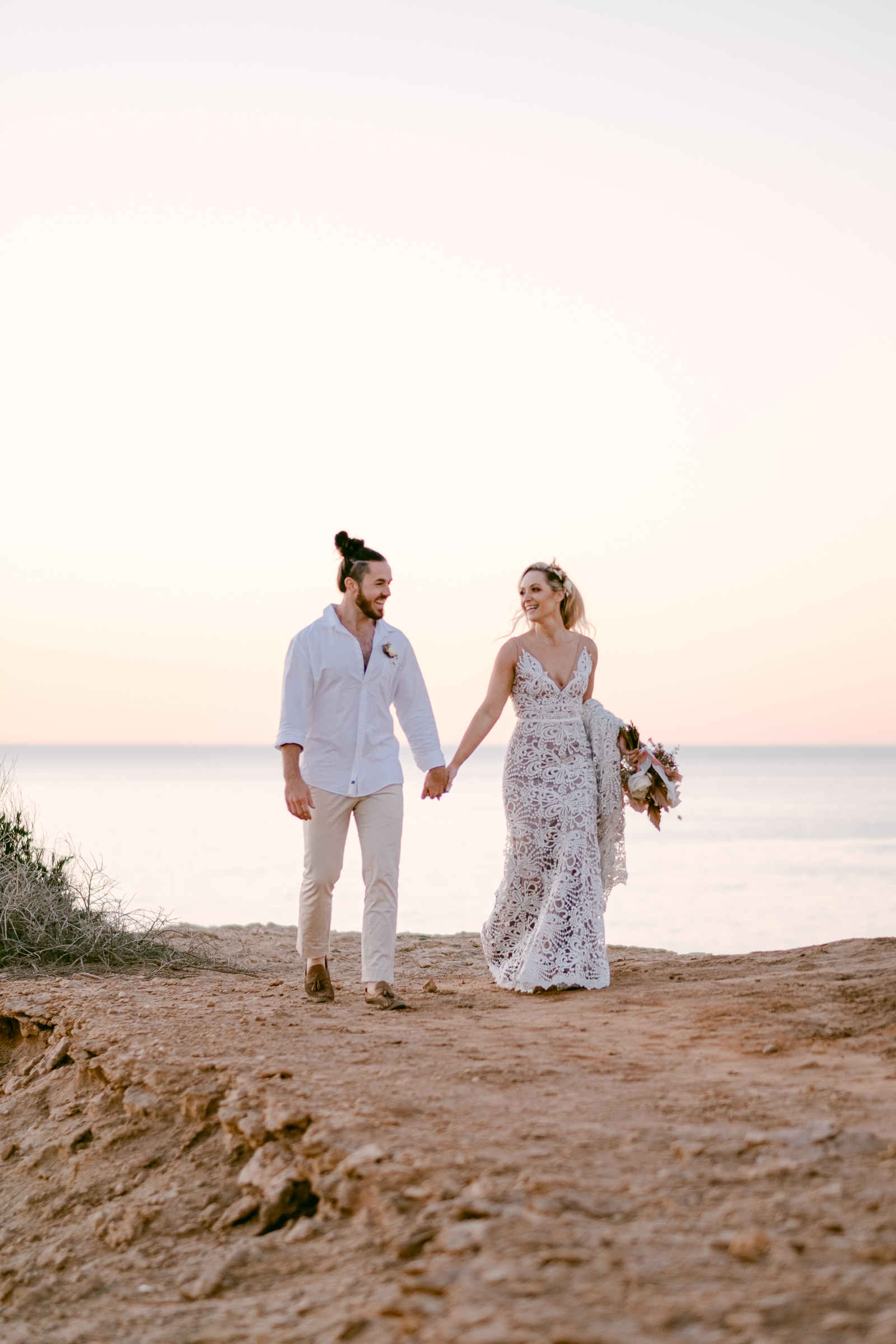 a couple walk hand-in-hand during their adventure elopement session