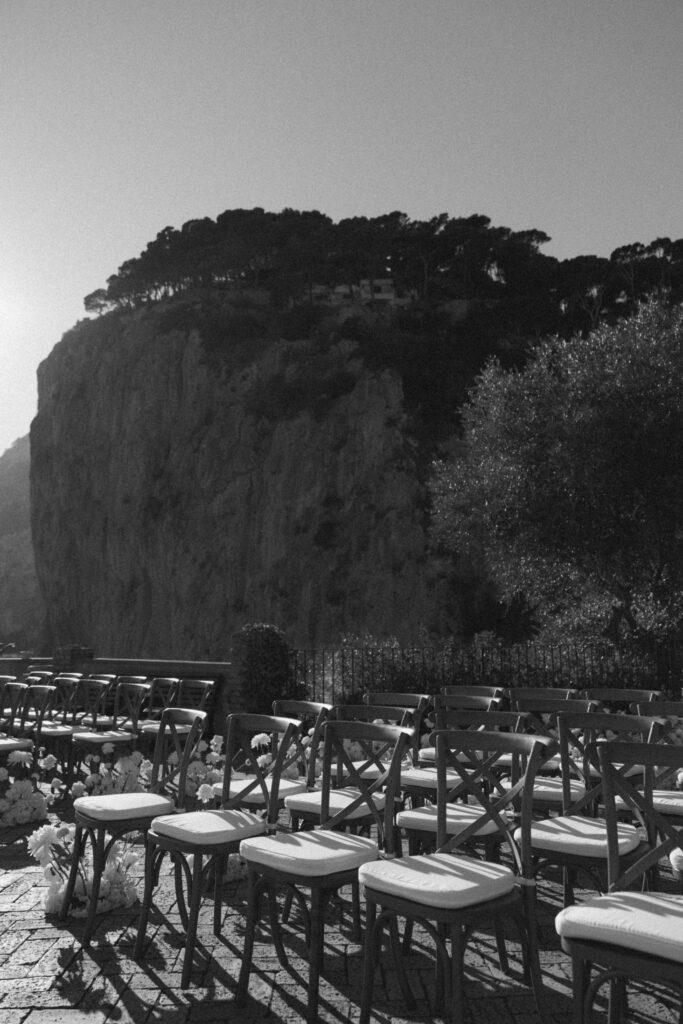 Destination wedding ceremony seating overlooking cliffs in Capri Italy
