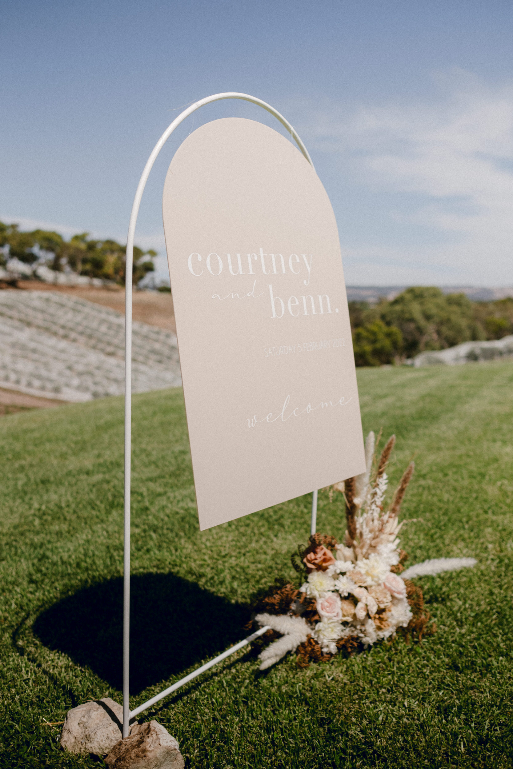 wedding signage on the hill overlooking the vineyards of Paxton Wines