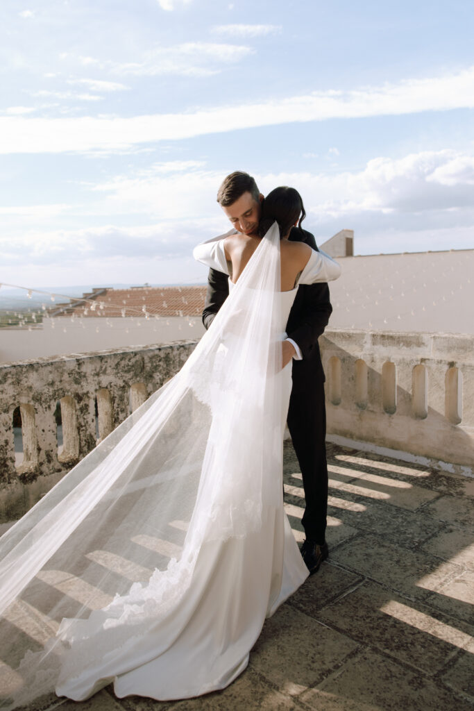 Bride and groom share a first look before their wedding ceremony on the rooftop at Masseria Amastuola in Puglia