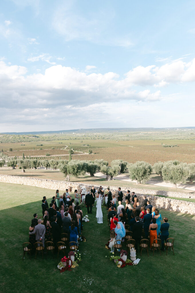 Wedding ceremony set against the rolling countryside at Masseria Amastuola in Puglia