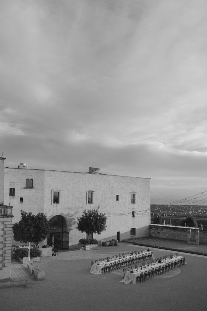 Black and white view of the courtyard and ceremony layout at Masseria Amastuola in Puglia