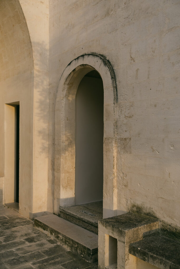 Arched stone doorway and historic architecture at Masseria Amastuola in Puglia