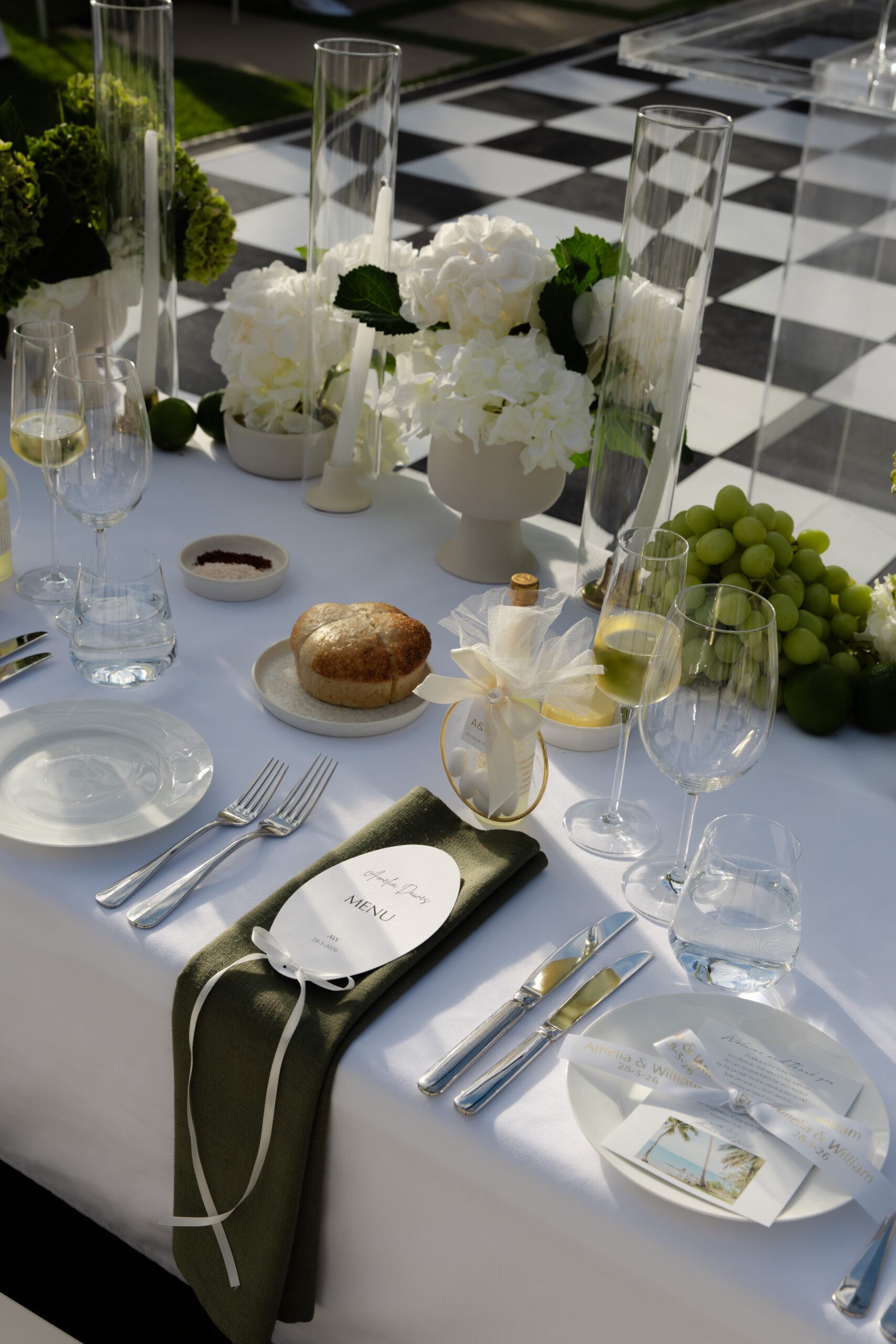 digital wedding photography, styled reception table with white florals, glassware and place settings, sharp detail on greenery and crystal, Evelina Katarzyński