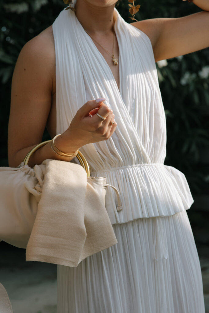 Bridal dress and bag detail at Quinta da Comporta wedding welcome dinner